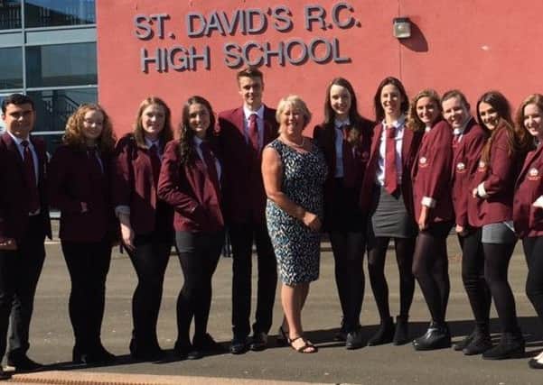 Head teacher Wendy Sutherland with pupils at St David's High School, Dalkeith