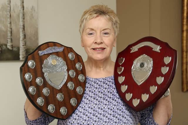 Jane Pearson, with the Neil Wyse trophies, the wife of the school janitor (now deceased) who started the annaul football tournament between the three local primary schools in memory of nine year old Neil Wyse who was murdered at Gore Glen in December 1992.