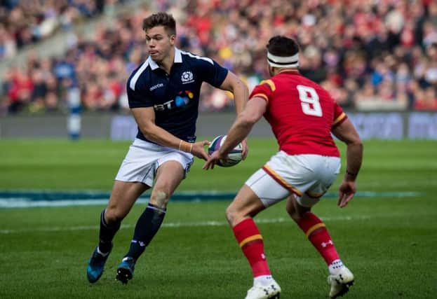 Scotland's Huw Jones in action against Wales' Rhys Webb. Pic: SNS/Ross Parker