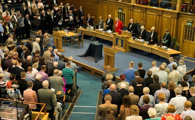 Commissioners bowed their heads in prayer and a minute of silence for the victims in Manchester. Picture: Andrew O'Brien