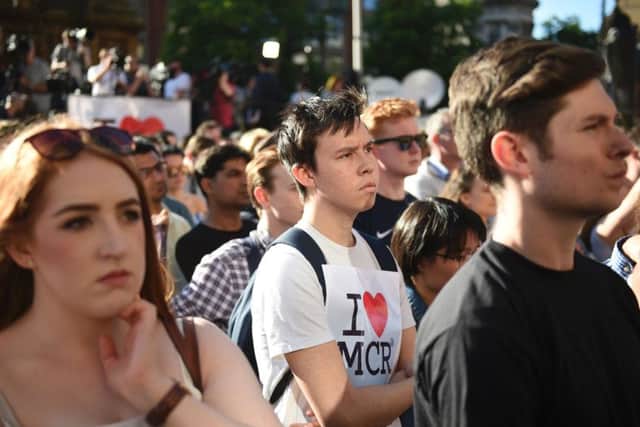 People attend a vigil in Albert Square in Manchester the day after the attack. Picture: AFP/Getty Images