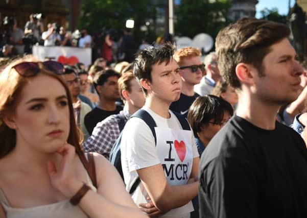 People attend a vigil in Albert Square in Manchester the day after the attack. Picture: AFP/Getty Images
