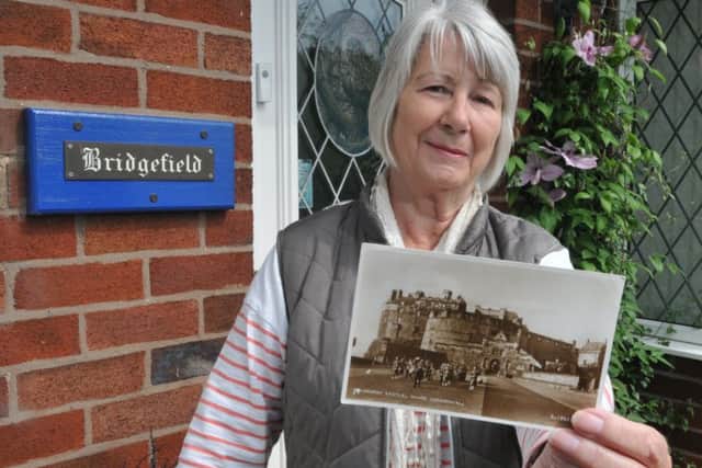 Lynn Harter received a postcard through the letterbox earlier in the week which was sent in September 1955. Picture: SWNS
