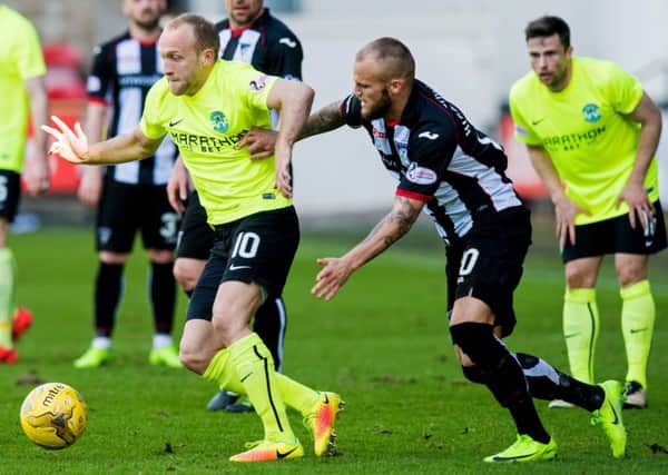 Hibs' Dylan McGeouch takes on Dunfermline's Kallum Higginbotham during the 1-1 league draw back in April. Pic: SNS
