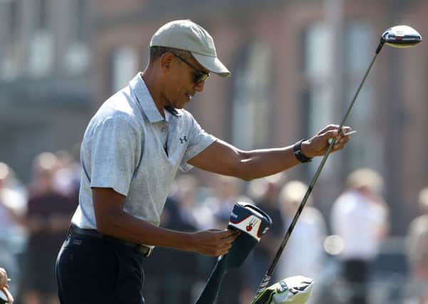 Former US president Barack Obama prepares to tee off at the first hole at St Andrews Golf Club. Picture; PA
