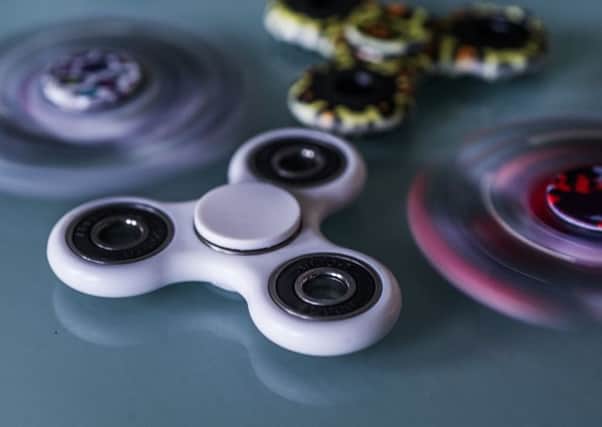 Fidget spinners (above) are the latest craze however, new dangerous toys are appearing online.