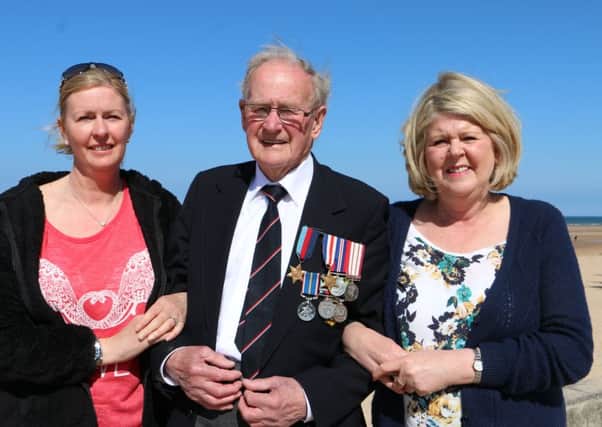 Joined by daughters Carolyn and Margaret Mr Horne returned to Normandy for the first time. Picture: Contributed