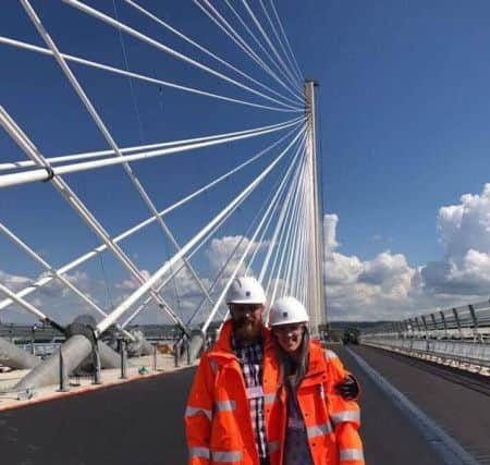 Newly-engaged coulpe Mark McDonald and Carrie Taylor
 on the nearly-finished Queensferry Crossing.
 Picture: cascadenews.co.uk