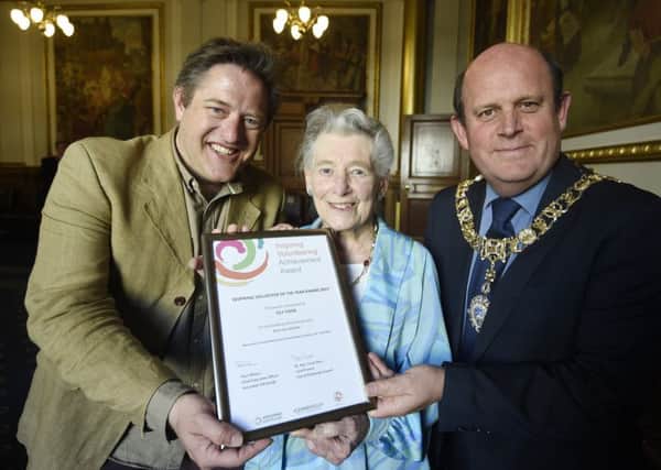 Volunteer Lily Cook with Edward Hibbert (a trustee at Volunteer Edinburgh), left, and Lord Provost Frank Ross. Picture: Greg Macvean