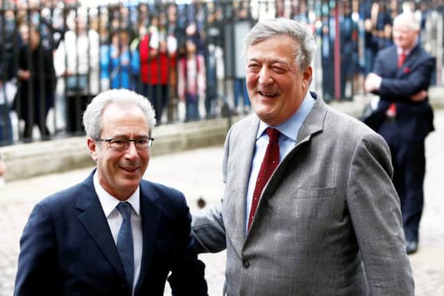 Ben Elton and Stephen Fry arrive at the memorial. Picture: SWNS