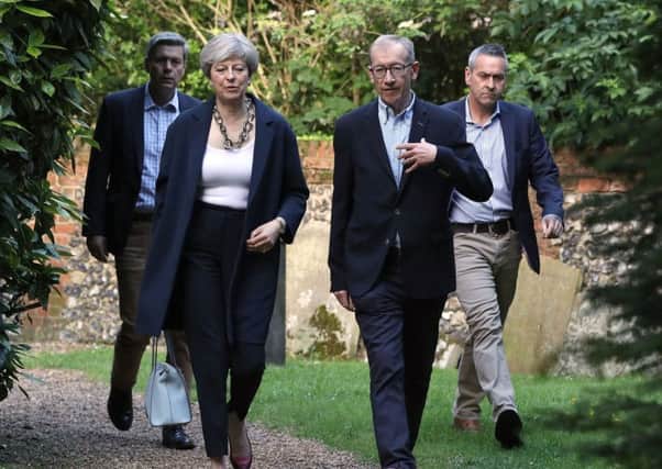 Prime Minister Theresa May and her husband Philip attend a church service. Picture; PA