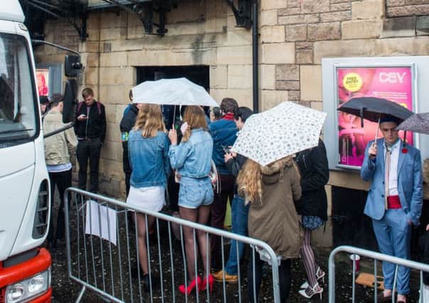 Extras queue outside Cav ahead of T2 filming. Pic: Ian Georgeson