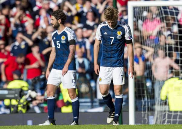 Stuart Armstrong is left dejected after Scotland conceded in injury time