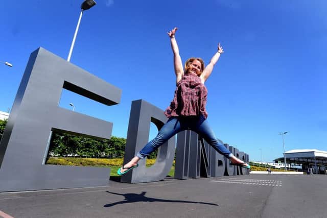 Mollie Hughes celebrates at Edinburgh Airport. Picture: Lisa Ferguson