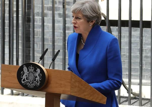 Prime Minister Theresa May speaks outside 10 Downing Street after returning from Buckingham Palace. Picture; Getty