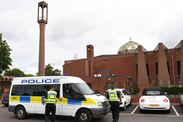 Police outside central mosque in Glasgow. Pic: SWNS