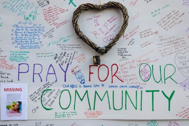 A wall of tributes and messages of condolences for the victims sits on the side of a community centre near to the site of the Grenfell Tower fire. Picture; Getty
