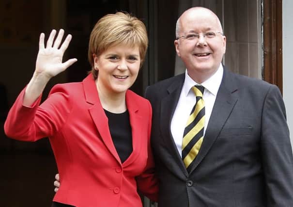 SNP leader Nicola Sturgeon with husband and election campaign manager Peter Murrell on polling day. Picture: Danny Lawson/PA Wire