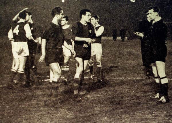German referee Malka, right, was chased around the field by angry Barcelona players.