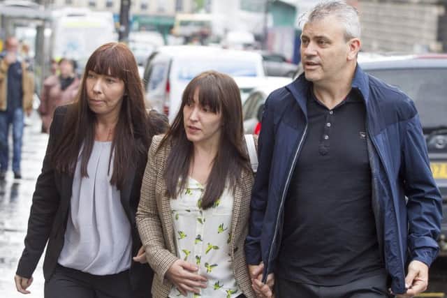 Abbie Wallis (centre), the mother of Keane Wallis-Bennett, arrives with her partner James Glendinning at Edinburgh Sheriff Court. Picture: SWNS