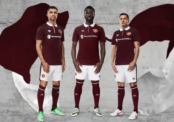 Aaron Hughes, Esmael Goncalves and Don Cowie show off the new home strip. Picture: Hearts FC