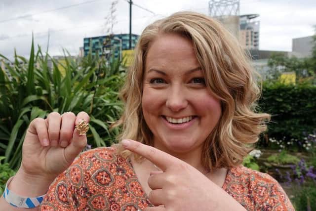 Mollie Hughes with her gold Blue Peter badge. Picture; SWNS