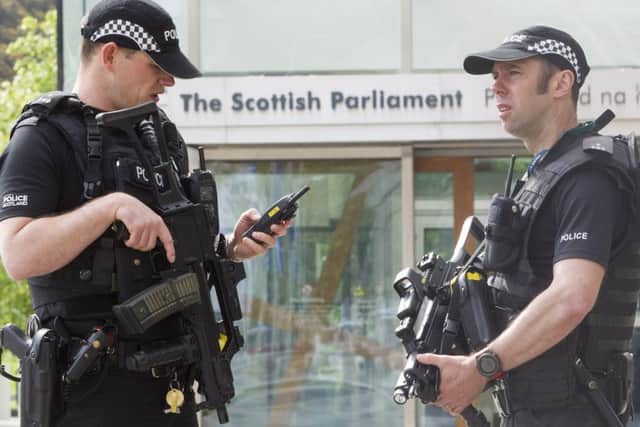 Armed Police are to continue outside The Scottish Parliament as Holyrood and other potential target areas have a heightened Police presence. Picture; SWNS