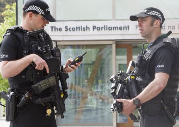 Armed Police are to continue outside The Scottish Parliament as Holyrood and other potential target areas have a heightened Police presence. Picture; SWNS