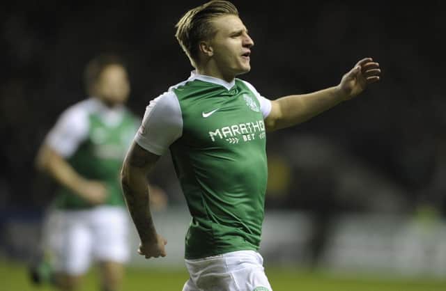 Jason Cummings celebrates after giving Hibs an early lead against Dundee United last season. The striker scored 55 times for the Easter Road club. Picture: Neil Hanna