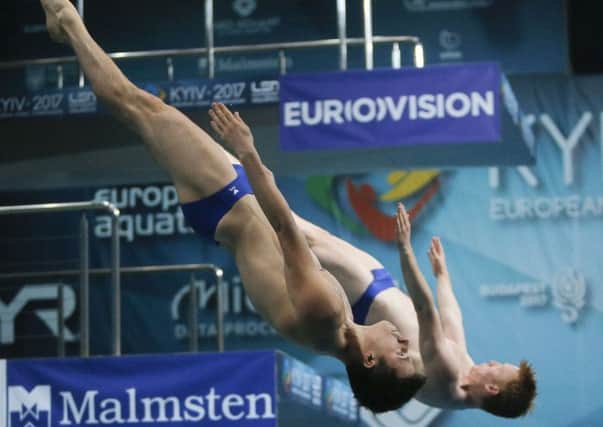 James Heatly, right, and Freddie Woodward on their way to winning the bronze medal in the men's 3m synchro springboard