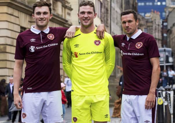 John Souttar, Jack Hamilton and Don Cowie model the new Hearts home kit