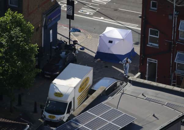 A forensic tent is erected at the scene in Finsbury Park area of north London after a vehichle hit pedestrians. Picture: Daniel leal-Olivas/Getty Images