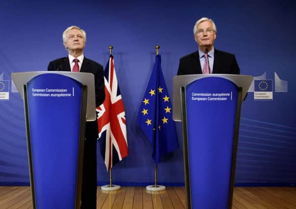 The European Union's chief negotiator Michel Barnier apeaks alongside the UK's Brexit minister  David Davis at exit talks yesterday. Picture; Getty