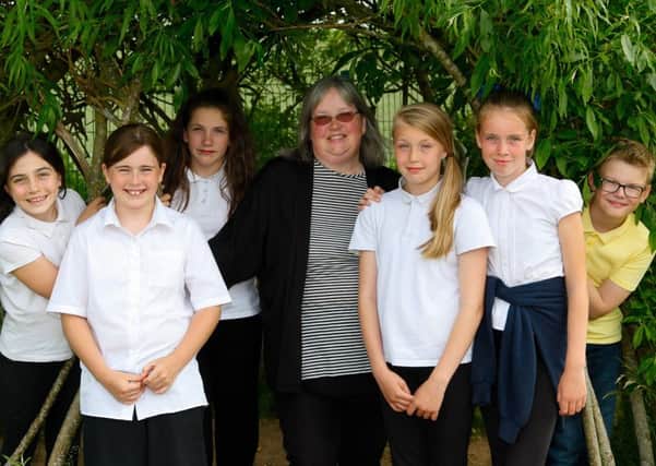 Jackie McNairn, a learning assistant and youth worker with Pathead Youth Project members who are P6 and P7 pupils at Tynewater Primary.