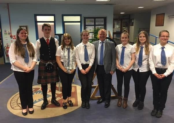 Newbattle head teacher Colin Taylor with some of the performers at the school's summer concert - Rachel Moffat, David Porteous (piper), Katherine Hunt, Ishbel Wright, Chiara Clark, Emily Donaldson and Esmee Wright.