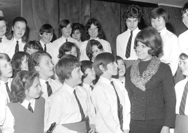 Moira Anderson talks to girls from Greenhall Secondary School Junior Choir