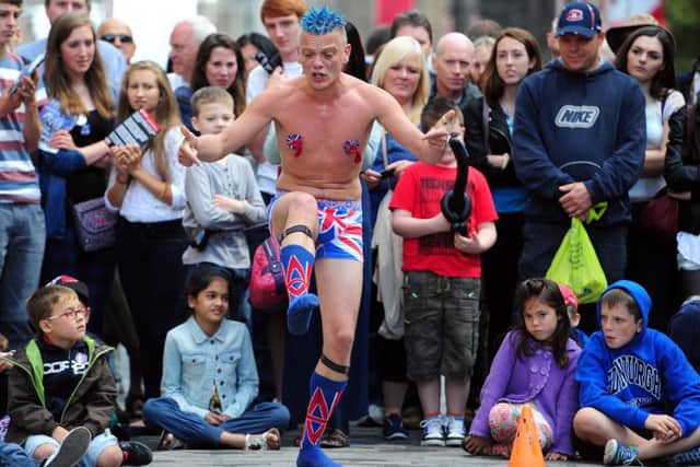 Street performers take to the Royal Mile during the Festival Fringe.  Picture: Ian Rutherford