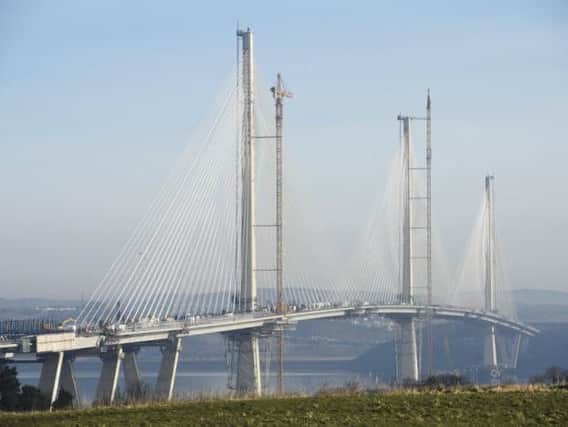 Bad weather problems, including delays to dismantling cranes, have delayed the Queensferry Crossing opening from last December to August. Picture: Greg Macvean