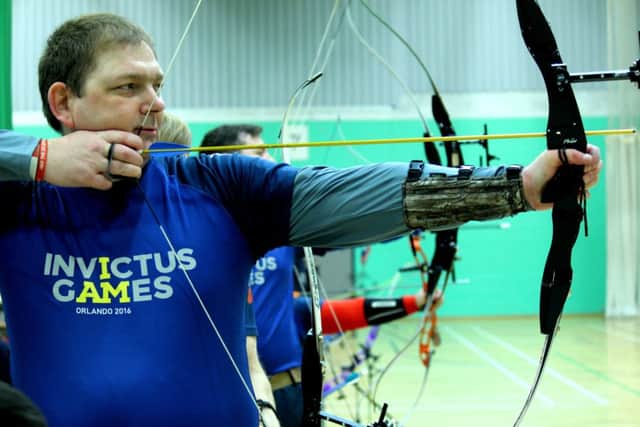 Terry Morgan in archery training.