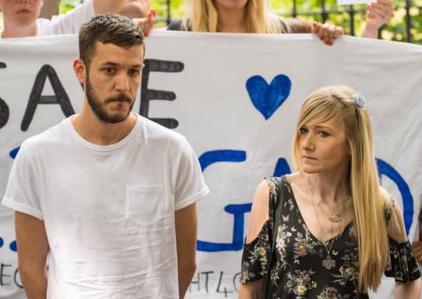 Parents of Charlie Gard, Connie Yates and Chris Gard, speak to the media in Queen Square, London. Picture: Dominic Lipinski/PA Wire