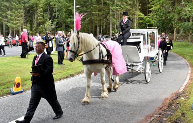 Hundreds attended the five-year-old's funeral with many dressing in superhero costumes or bright pink dresses in her honour. Picture: SWNS