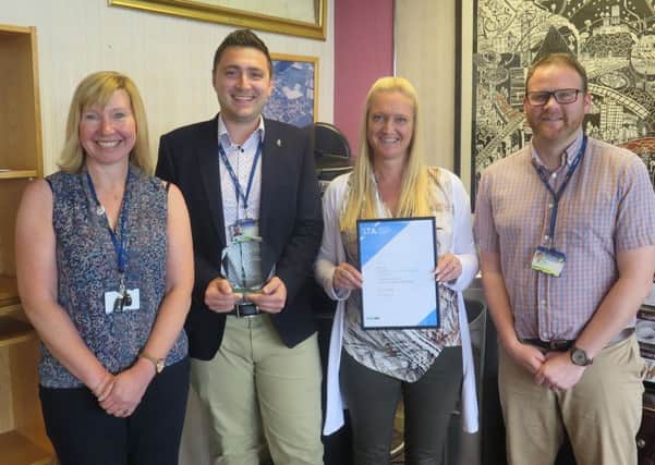Members of the Active Travel team at Midlothian Council are pictured with their award for excellence in travel information and marketing. (L to R) Gillian Bathgate (School Travel Plan Co-ordinator) Bogdan Handrea (Sustainable Travel Officer) Lindsay Haddow (Policy Planning Manager) Stephen MacPhail (GIS Technician)