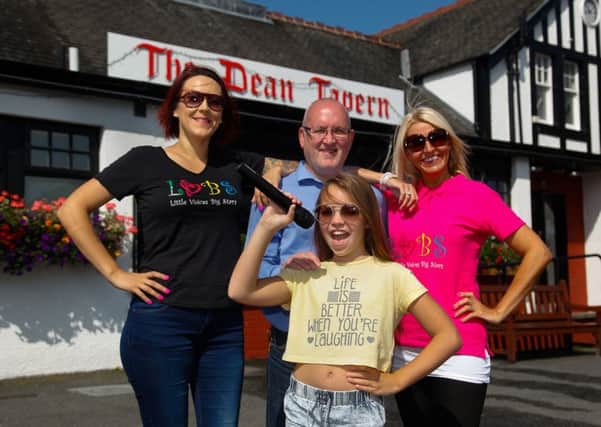 Vicki Beveridge and Yvonne Williams from singing group Little Voices Big Stars with Darren Smith, Manager of The Dean Tavern with Rai Williams (10), Yvonne's daughter.