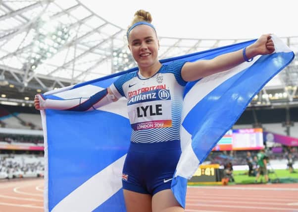 Maria Lyle celebrates winning bronze in the T35 100m