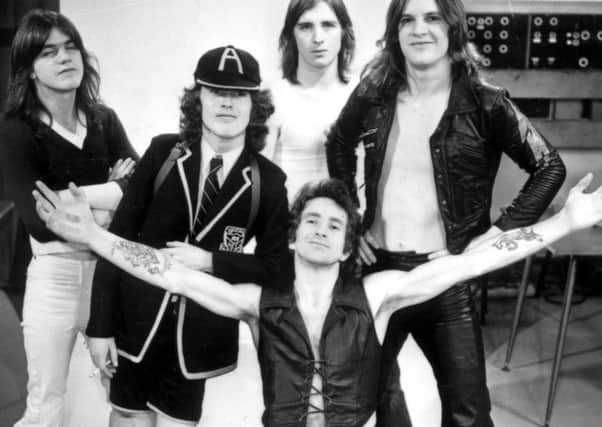 Bon Scott fronts the band in their 1970s heyday. Picture: Rex Features