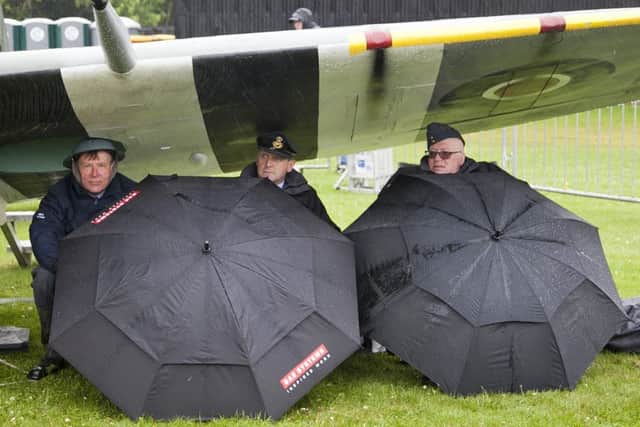 rew members sitting under the wing of a spitfire. Picture: Alistair Linforth.