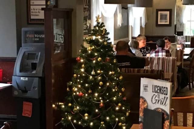 A Christmas tree has been put up in a pub in Bristol.