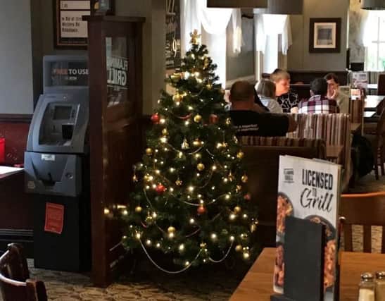 A Christmas tree has been put up in a pub in Bristol.