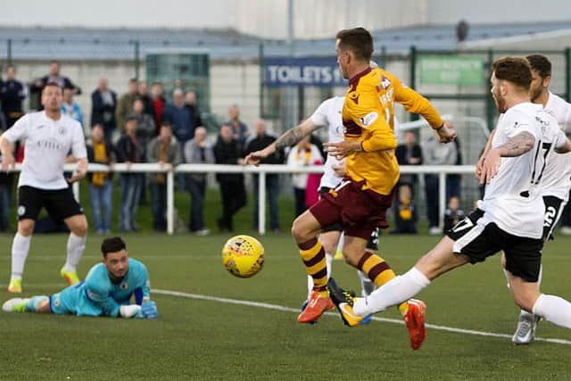 Elliot Frear knocks in a late winner for Motherwell to leave Edinburgh City shattered. Pic: SNS
