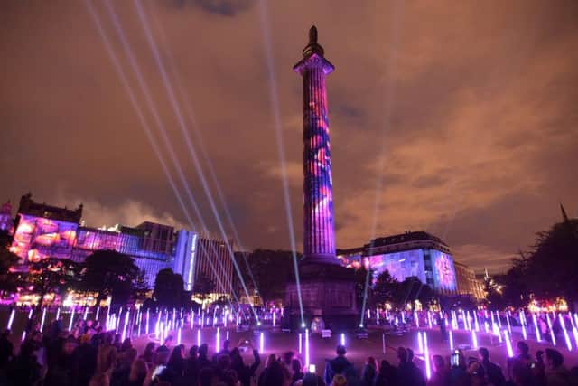The Melville Monument in St Andrew Square is illuminated as part of Bloom. Picture: Lesley Martin